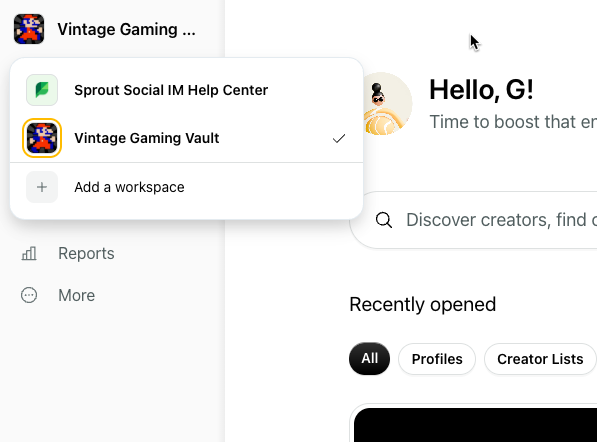 A screenshot of a desktop application interface. On the left, a dropdown menu is open, showing "Vintage Gaming..." as the current workspace, with options to switch to "Sprout Social IM Help Center" or "Vintage Gaming Vault." Below these options, there's an "Add a workspace" button. Further down the left sidebar, "Reports" and "More" are visible. On the right side of the screen, the main content area has a greeting "Hello, G!" and a search bar labeled "Discover creators, find o". Below this, there are tabs for "All," "Profiles," and "Creator Lists" under the "Recently opened" section.